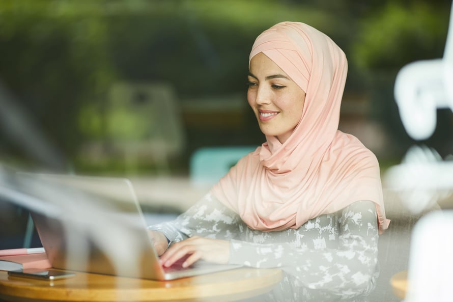 muslim-woman-answering-e-mails-2022-02-08-22-39-25-utc-min